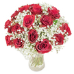 A lush, rounded bouquet of roughly eighteen to twenty deep crimson roses nestles within a clear glass vase, each bloom opened to reveal velvety, spiralling petals that catch bright, even light. Surrounding the roses are abundant clouds of delicate white baby's breath (gypsophila), their tiny star-like blossoms softening the intense crimson with a feathery, almost mist-like halo. Through the transparent vase the long, verdant green stems are visible, cut cleanly and gathered to form a compact, domed silhouette; the glass glints faintly where sunlight kisses the water, grounding the arrangement in natural freshness. The tactile contrast between the smooth, plush rose petals and the whisper-light gypsophila creates a layered sensory impression - the roses give warmth and depth, the baby's breath imparts innocence and airiness - while a subtle, classic rose perfume seems to hover just beyond the petals, inviting a slow inhale. Set against a pristine white backdrop, every contour and shadow registers clearly: the rich crimson reads as luxurious and romantic, the cloud of white as tender and lifting. This composition reads as a timeless declaration of love, ideal for anniversaries, romantic surprises, or to mark a moment of sincere affection. As a florist I note how the compact, carefully balanced design makes it as comfortable to hold as it is striking to display, and how the overall effect remains elegant whether placed on a mantel, a dining table, or offered in the heart of Chinatown near Gerrard Street and Leicester Square to mark an intimate celebration.