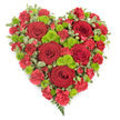In this photograph, a striking heart-shaped floral arrangement stands out against a bright white background, highlighting every detail as clearly as if you were viewing it in a Chinatown Flowers studio before a memorial service. The heart is filled edge-to-edge with blossoms, creating a lush, continuous surface of colour and texture. Dominating the design are several large deep red roses, each bloom full and velvety, their layered petals spiralling inward to form classic, romantic centres that immediately draw attention. Surrounding and connecting these roses, an abundance of red mini carnations creates a soft, frilled tapestry, the smaller petals overlapping to give a sense of volume and gentle movement. Throughout the red expanse, clusters of lime-green button chrysanthemums are carefully placed, their rounded, compact heads offering a crisp, contemporary contrast that brightens the composition and adds visual rhythm. Bordering the heart, small pieces of variegated pittosporum foliage, with cream-edged green leaves, form a subtle frame that defines the shape while preserving a natural, garden-fresh feel. From the pointed base of the heart, a few delicate fern fronds trail downward, adding an airy, graceful finish, like foliage gathered from a quiet courtyard or nearby green space off Shaftesbury Avenue. The design is balanced and symmetrical, giving the impression of careful craftsmanship and thoughtful intent. This floral heart would make a meaningful tribute for funerals, wakes, or remembrance ceremonies in and around Chinatown, offering a vivid expression of love, respect, and enduring memory, particularly for families wishing to honour their loved one with a strong and timeless symbol.