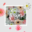 This bouquet presents a gentle contrast to the colourful bustle of Chinatown, offering a soft, pastel pause amid the vivid reds and golds of the neighbourhood. At its core, blush pink roses bloom in full, layered spirals, each petal smooth and velvety, catching the light as though brushed with a faint sheen. These roses are framed by gerberas in creamy peach and cooler blush hues, their wider, disk-shaped faces and neatly arranged petals lending a modern, structured feel that balances the romantic softness of the roses. Fine stems of white gypsophila are woven throughout, their countless tiny blossoms forming a delicate, cloud-like veil that lightens the entire composition, reminiscent of distant lanterns glowing softly in the evening air. Nestled between and beneath the main blooms, white chrysanthemums add a crisper texture and a more compact form, their tidy layers of petals contributing both volume and a clean brightness that plays beautifully against the pastel tones. The overall palette is understated and harmonious-pinks, peaches, and whites mingling gracefully, like early daylight filtering into side streets off Gerrard Street before the day fully begins. The bouquet looks freshly arranged, likely hand-tied, with stems gathered into a pleasing dome and foliage kept minimal to allow the flowers to take centre stage. It radiates a mood of calm affection and quiet joy, ideal for any occasion: a birthday in a nearby apartment, a thank-you gift for a local business owner, or a simple gesture of love. Imagined as a monthly flower subscription, each fresh delivery would bring a repeated moment of soft beauty and grounding peace into homes and workspaces throughout Chinatown.
