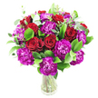 A generous, rounded bouquet of deep red roses and magenta-purple carnations sits in a simple clear glass vase, the stems visible through the water and the composition photographed against a crisp white background. The roses, some tightly furled and others tentatively unfurled, display their velvety spiraled centers and a soft sheen that catches a cool, even light; their rich crimson reads as classic romance. Interwoven among them are camellia-dense clusters of ruffled carnations in a saturated fuchsia-purple, their frilly, layered petals creating tactile contrast and playful movement across the arrangement. Bright, glossy green foliage - likely ruscus or similar broad leaves - forms a full, verdant base, while slender, silvery-green eucalyptus sprigs lift and lighten the silhouette with subtle aroma and a modern, airy feel. The overall texture alternates between plush petals and crisp leaves, producing a lively depth that feels both luxurious and approachable. Composed to be full and lush, the bouquet's dense cluster suggests a thoughtful occasion - an anniversary, Valentine's sentiment, or a generous congratulatory gift - and its clean presentation makes it at home on a dining table or reception desk. Lighting is soft and neutral, allowing the reds and purples to pop without harsh shadows, and the transparent vase keeps the attention on the seasonal freshness of stems and blooms. Offered from a local Chinatown florist, this arrangement reads as an elegant declaration of affection or celebration for anyone in the neighbourhood seeking a refined, heartfelt floral delivery.
