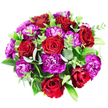 This overhead photograph shows a full, circular bouquet set against a smooth white background, its colours echoing the lively, colourful character of Chinatown. The design centres around a grouping of lush red roses, their velvety petals elegantly layered from the tightly curled interiors to the softer, more open outer whorls. The roses display a range of red shades, from bright, classic scarlet to deeper burgundy glints in the folds, creating a feeling of richness and romance. Nestled closely among them, clusters of magenta and purple carnations add volume and intricate texture. Their distinctive ruffled, serrated petals fan outwards, with some blooms glowing in vivid fuchsia and others settling into darker plum and royal purple, forming a harmonious yet dynamic contrast with the roses. Interwoven through the arrangement are stems of eucalyptus, their round, silvery-green leaves offering a fresh, cooling tone that lightens the composition. Complementing them, broader dark green foliage, likely Ruscus or Salal, provides structure and a glossy backdrop, while slimmer stems of brighter green leaves peek between the flowers, giving a freshly arranged, almost garden-picked look, as if prepared just moments ago in a Chinatown Flowers studio near the heart of the district. The bouquet is tightly packed and perfectly rounded, forming a dome of petals and leaves that feels generous and complete. Soft, even lighting illuminates every detail, ensuring the interplay of red, purple, and green remains the focus. The overall impression is one of celebration and heartfelt emotion, ideal for anniversaries, birthdays, or simply sending a luxurious, vibrant token of affection to someone special in and around Chinatown.
